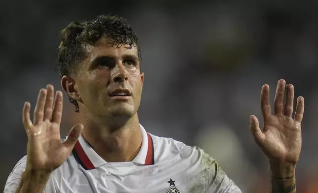 AC Milan forward Christian Pulisic waves to the crowd after a friendly soccer match against Real Madrid, Wednesday, July 31, 2024, in Chicago. (AP Photo/Erin Hooley)