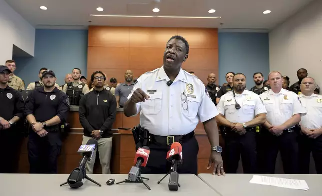 Ferguson Police Chief Troy Doyle gives a press conference on Saturday, Aug. 10, 2024 about the incident outside the Ferguson, Mo., police station on Friday night where a Ferguson officer was injured and is listed in critical condition with a brain injury. Officer Travis Brown was hurt in a chaotic scene where police were moving in to arrest people who damaged a fence around the police station. (David Carson/St. Louis Post-Dispatch via AP)