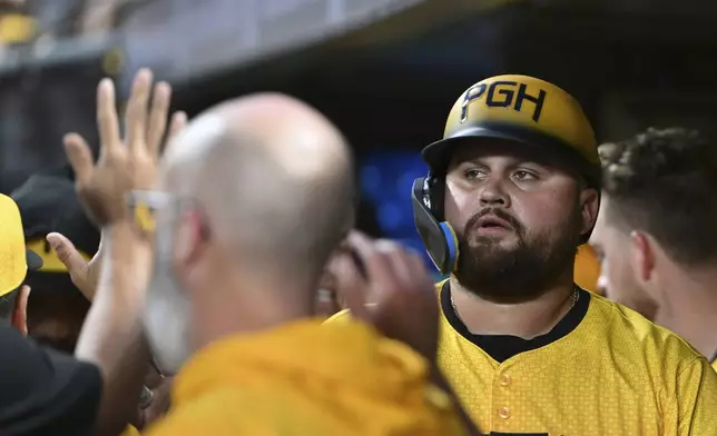 Pittsburgh Pirates first base Rowdy Tellez celebrates after scoring against the Cincinnati Reds in the fifth inning of a baseball game, Friday, Aug. 23, 2024, in Pittsburgh. (AP Photo/Barry Reeger)