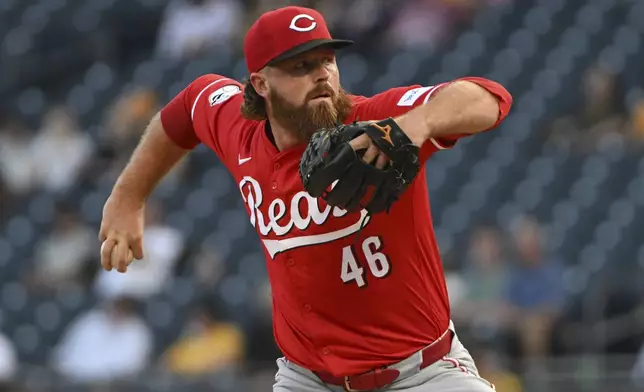 Cincinnati Reds pitcher Buck Farmer delivers against the Pittsburgh Pirates in the first inning of a baseball game, Friday, Aug. 23, 2024, in Pittsburgh. (AP Photo/Barry Reeger)