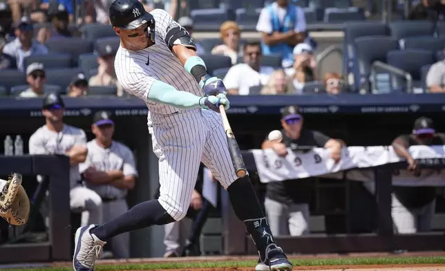 New York Yankees' Aaron Judge hits a home run during the first inning of a baseball game against the Colorado Rockies, Sunday, Aug. 25, 2024, in New York. (AP Photo/Bryan Woolston)