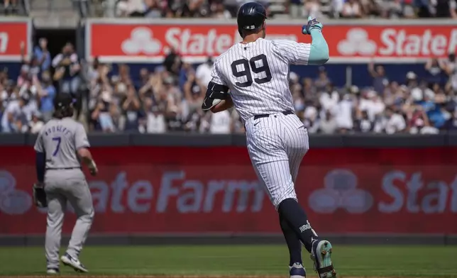 New York Yankees' Aaron Judge (99) runs the bases after hitting a home run during the first inning of a baseball game against the Colorado Rockies, Sunday, Aug. 25, 2024, in New York. (AP Photo/Bryan Woolston)