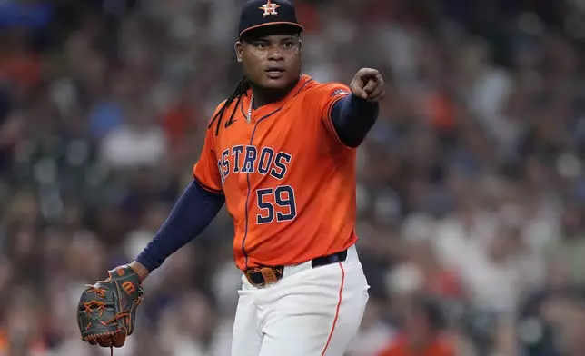 Houston Astros starting pitcher Framber Valdez appeals to first base umpire Phil Cuzzi on a checked swing by Kansas City Royals' Freddy Fermin during the seventh inning of a baseball game Friday, Aug. 30, 2024, in Houston. (AP Photo/Kevin M. Cox)