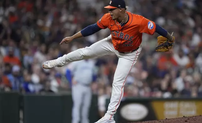 Houston Astros relief pitcher Bryan Abreu delivers during the eighth inning of a baseball game against the Kansas City Royals, Friday, Aug. 30, 2024, in Houston. (AP Photo/Kevin M. Cox)