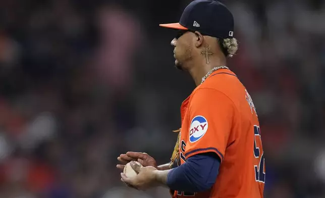 Houston Astros relief pitcher Bryan Abreu walks near the mound after giving up a base hit to Kansas City Royals pinch-hitter Kyle Isbel during the eighth inning of a baseball game Friday, Aug. 30, 2024, in Houston. (AP Photo/Kevin M. Cox)