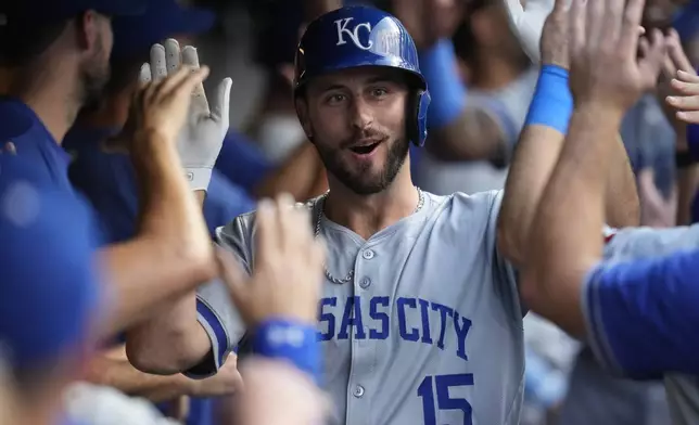 Kansas City Royals' Paul DeJong celebrates his home run in the second inning of a baseball game against the Cleveland Guardians, Tuesday, Aug. 27, 2024, in Cleveland. (AP Photo/Sue Ogrocki)