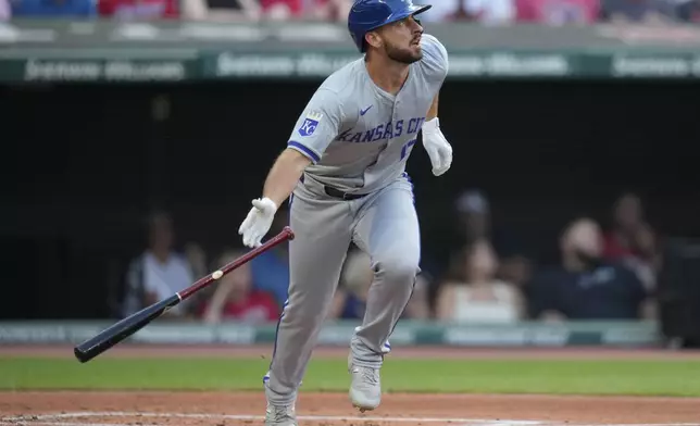 Kansas City Royals' Paul DeJong watches his home run in the second inning of a baseball game against the Cleveland Guardians, Tuesday, Aug. 27, 2024, in Cleveland. (AP Photo/Sue Ogrocki)