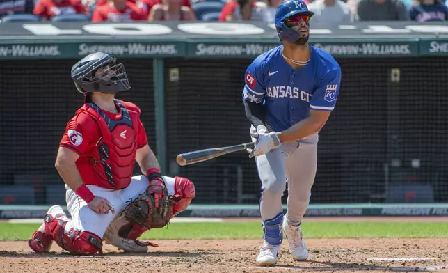 Kansas City Royals' MJ Melendez, right, watches his three-run home run off Cleveland Guardians relief pitcher Eli Morgan along with Austin Hedges, left, during the fourth inning of the first game of a baseball doubleheader in Cleveland, Monday, Aug. 26, 2024. (AP Photo/Phil Long)