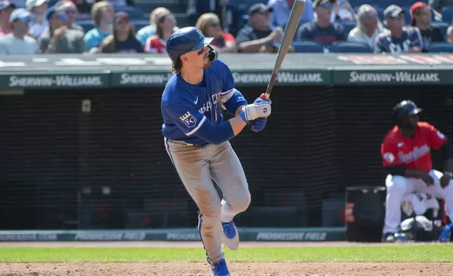 Kansas City Royals' Bobby Witt Jr. watches his solo home run off Cleveland Guardians relief pitcher Hunter Gaddis during the eighth inning of the first game of a baseball doubleheader in Cleveland, Monday, Aug. 26, 2024. (AP Photo/Phil Long)