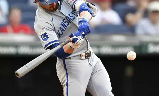 Kansas City Royals' Bobby Witt Jr. hits a double during the third inning of the second game of a baseball doubleheader against the Cleveland Guardians, Monday, Aug. 26, 2024, in Cleveland. (AP Photo/Nick Cammett)