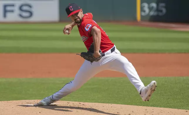 Cleveland Guardians starting pitcher Nick Sandlin delivers against the Kansas City Royals during the first inning of the first game of a baseball doubleheader in Cleveland, Monday, Aug. 26, 2024. (AP Photo/Phil Long)