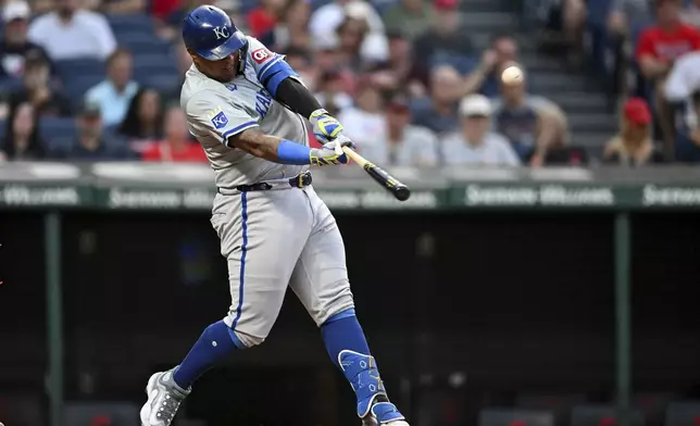 Kansas City Royals' Salvador Perez hits a solo home run during the fifth inning of the second game of a baseball doubleheader against the Cleveland Guardians, Monday, Aug. 26, 2024, in Cleveland. (AP Photo/Nick Cammett)