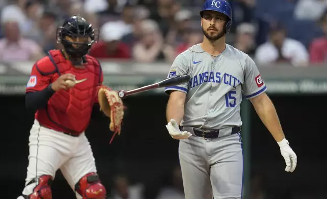 Kansas City Royals' Paul DeJong (15) flips his bat in front of Cleveland Guardians fourth inning of a baseball game Tuesday, Aug. 27, 2024, in Cleveland. (AP Photo/Sue Ogrocki)