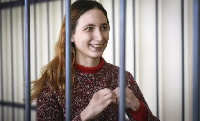 FILE - Sasha Skochilenko, an artist and musician, stands in a defendants’ cage in a courtroom in St. Petersburg, Russia, on April 13, 2022. (AP Photo, File)