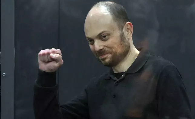 FILE - Russian opposition activist Vladimir Kara-Murza gestures standing in a glass cage in a courtroom during announcement of the verdict on appeal at the Moscow City Court in Moscow, Russia, on July 31, 2023. Kara-Murza, a prominent opposition politician and a dual Russian-U.K. citizen, was convicted of treason and other charges in 2023 and sentenced to 25 years in prison. He has rejected the charges as politically motivated. (AP Photo, File)