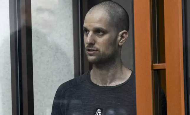 FILE - Wall Street Journal reporter Evan Gershkovich stands listening to the verdict in a glass cage of a courtroom inside the building of "Palace of justice," in Yekaterinburg, Russia, on Friday, July 19, 2024. (AP Photo, File)