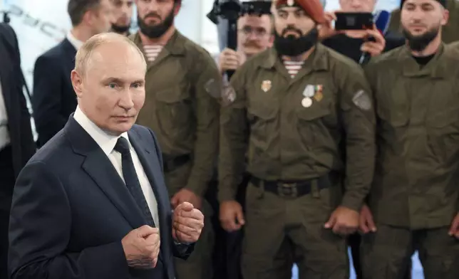 Russian President Vladimir Putin talks to servicemen during his visit to the Special Forces University in Gudermes, Chechen Republic, Russia, Tuesday, Aug. 20, 2024. (Alexei Danichev, Sputnik, Kremlin Pool Photo via AP)