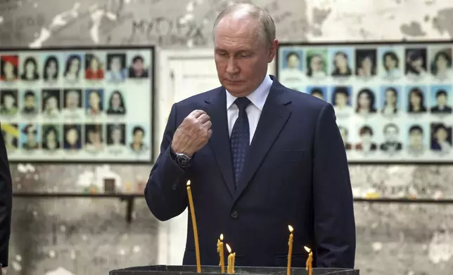 Russian President Vladimir Putin visits the School No1 attacked by terrorists in 2004, in Beslan, Republic of North Ossetia-Alania, Russia, Tuesday, Aug. 20, 2024. (Sergei Karpukhin, Sputnik, Kremlin Pool Photo via AP)