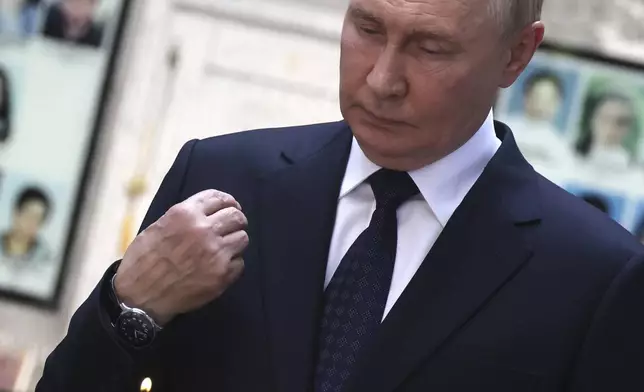 Russian President Vladimir Putin visits the School No1 attacked by terrorists in 2004, in Beslan, Republic of North Ossetia-Alania, Russia, Tuesday, Aug. 20, 2024. (Sergei Karpukhin, Sputnik, Kremlin Pool Photo via AP)