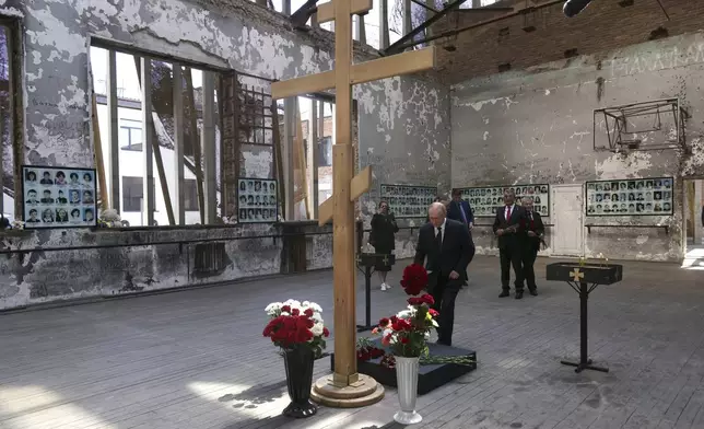 Russian President Vladimir Putin visits the School No1 attacked by terrorists in 2004, in Beslan, Republic of North Ossetia-Alania, Russia, Tuesday, Aug. 20, 2024. (Sergei Karpukhin, Sputnik, Kremlin Pool Photo via AP)