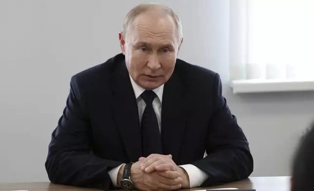 Russian President Vladimir Putin meets with representatives of the Association of Victims of Terrorist Acts "Mothers of Beslan", in Beslan, Republic of North Ossetia-Alania, Russia, Tuesday, Aug. 20, 2024. (Vyacheslav Prokofyev, Sputnik, Kremlin Pool Photo via AP)