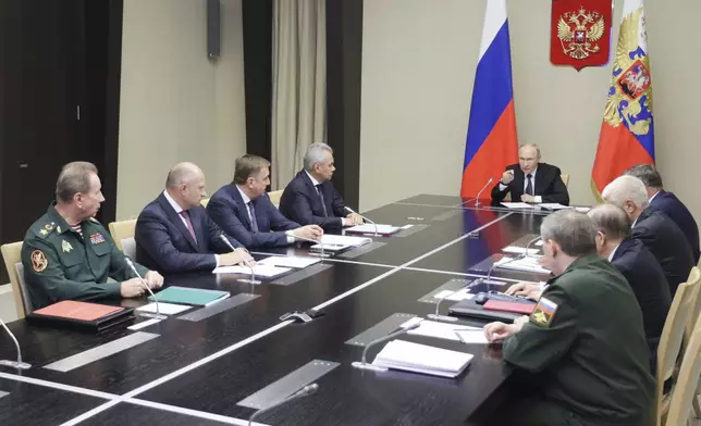 Russian President Vladimir Putin leads the meeting with top security and defense officials about the situation in Kursk and Belgorod border regions, at Novo-Ogaryovo state residence outside of Moscow, Russia, Monday, Aug. 12, 2024. (Gavriil Grigorov, Sputnik, Kremlin Pool Photo via AP)