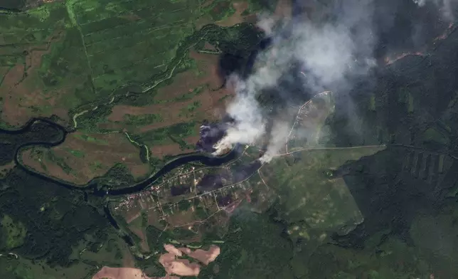 This satellite image released by Planet Labs PBC shows fires near the village of Krasnooktyabrskoe in Russia's Kursk region on Tuesday, Aug. 20, 2024. (Planet Labs PBC via AP)