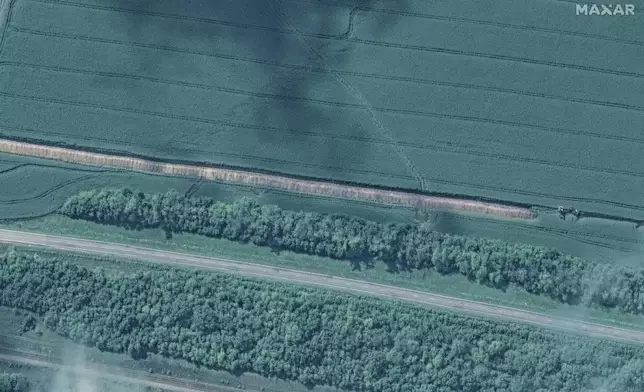 This image released by Maxar Technologies shows a trench being built southeast of Lgov, west of Kursk, Russia, Monday Aug. 12, 2024. (Satellite image ©2024 Maxar Technologies via AP)