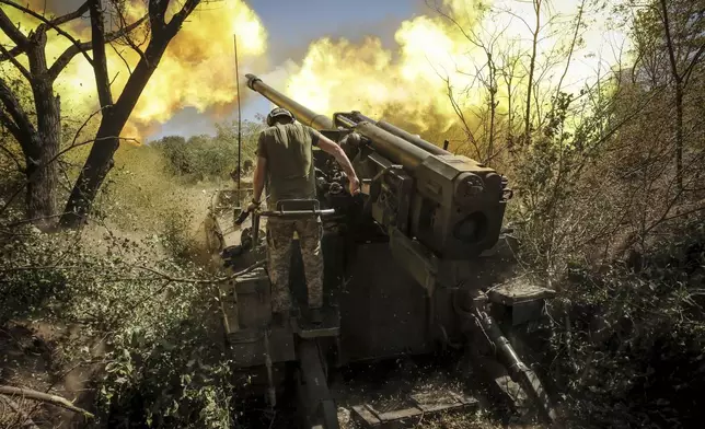 In this photo provided by Ukraine's 24th Mechanised Brigade press service, servicemen of the 24th Mechanised Brigade fire a" Giatsint-S" 152mm self-propelled howitzer towards Russian positions near Chasiv Yar town, in Donetsk region, Ukraine, Tuesday, Aug. 20, 2024. (Oleg Petrasiuk/Ukrainian 24th Mechanised Brigade via AP)