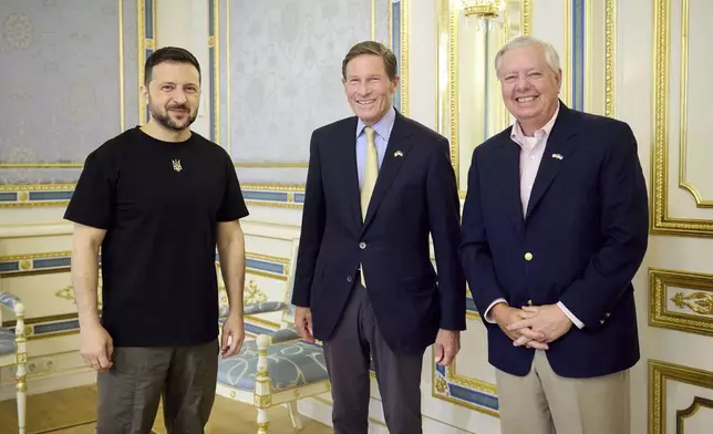 In this photo provided by the Ukrainian Presidential Press Office, Ukrainian President Volodymyr Zelenskyy, left, US Sen. Richard Blumenthal, centre, and D-Conn. and US Sen. Lindsey Graham (R-S.C.) pose for a photo in Kyiv, Ukraine, Monday, Aug. 12, 2024. (Ukrainian Presidential Press Office via AP)