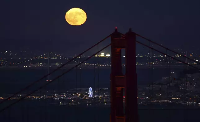 A supermoon is seen over San Francisco from Marin Headlands in Sausalito, Calif., on Monday, Aug. 19, 2024. (Scott Strazzante/San Francisco Chronicle via AP)