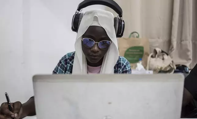 May Fall, 17 years-old , composes a music at a beat making class for women in Dakar, Senegal, Wednesday, Aug. 14, 2024. (AP Photo/Annika Hammerschlag)