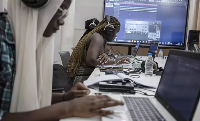 Students compose a music at a beat making class for women in Dakar, Senegal, Wednesday, Aug. 14, 2024. (AP Photo/Annika Hammerschlag)