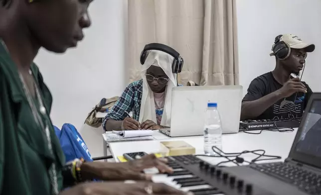 Students compose a music at a beat making class for women in Dakar, Senegal, Wednesday, Aug. 14, 2024. (AP Photo/Annika Hammerschlag)