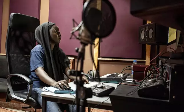 Aminata "Myamy TheAyGirl" Thiam, 31years - Old, creates a beat inside a studio in Dakar, Senegal, Wednesday, Aug. 14, 2024. Aminata Thiam is Senegal's first female beatmaker. (AP Photo/Annika Hammerschlag)