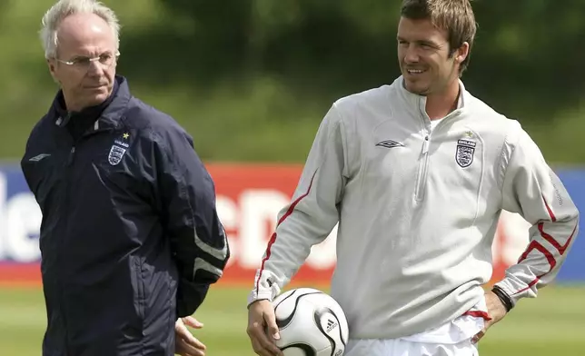 FILE - England's manager Sven-Goran Eriksson, left and player David Beckham are photographed during a training session, in Manchester, England, June 1, 2006. Eriksson the Swedish soccer manager who spent five years as England’s first ever foreign-born coach, has died. He was 76, it was announced on Monday, Aug. 26, 2024. (Martin Rickett/PA via AP, File)