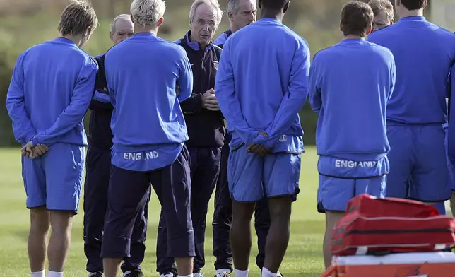 FILE - England coach Sven Goran Eriksson, fourth from the left, gives instructions to his players during a training session at Carrington training ground in Manchester, England, Monday Oct. 10, 2005 ahead of their World Cup qualifying soccer match against Poland. Eriksson the Swedish soccer manager who spent five years as England’s first ever foreign-born coach, has died. He was 76, it was announced on Monday, Aug. 26, 2024. (AP Photo/Jon Super, File)