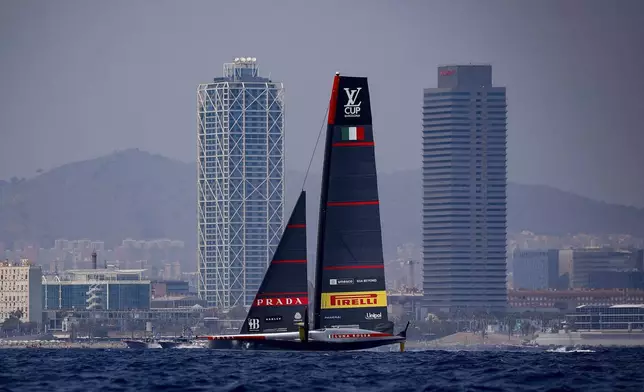 Luna Rosa Prada Pirelli Team's AC75 boat sails during America's Cup Preliminary Regatta ahead of the 37th America's Cup sailing race at the Barcelona's coast, Spain, Thursday, Aug. 22, 2024. The world's oldest international sports trophy, best yachtsmen and cutting-edge design and technology will come together in Barcelona when the 37th edition of the America's Cup starts on Thursday. (AP Photo/Joan Monfort)