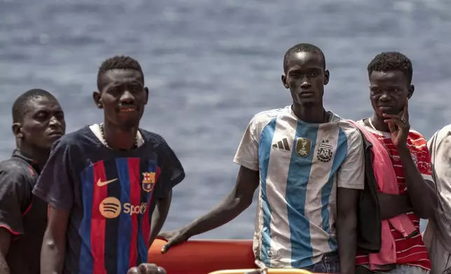 Migrants disembark at the port of "La Estaca" in Valverde at the Canary island of El Hierro, Spain, Monday, Aug. 26, 2024. Migrants arrived by boat after a thirteen-day voyage from the coast of Senegal. (AP Photo/Maria Ximena)