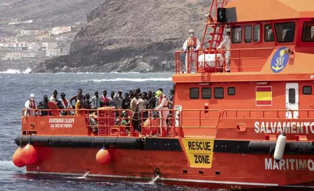 Migrants disembark at the port of on "La Estaca" in Valverde at the Canary island of El Hierro, Spain, Monday, Aug. 26, 2024. Migrants arrived by boat after a thirteen-day voyage from the coast of Senegal. (AP Photo/Maria Ximena)