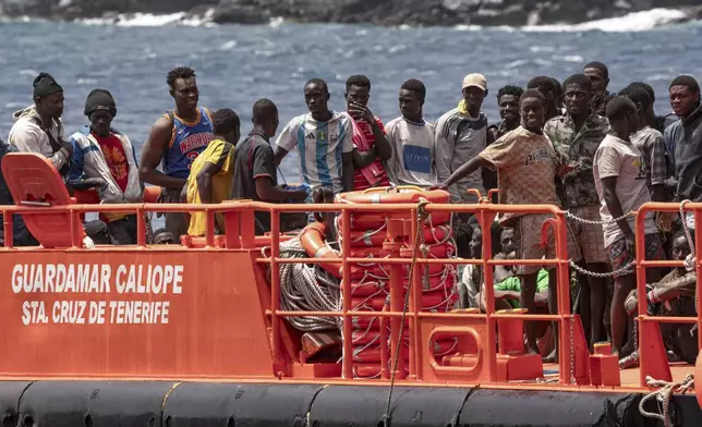 Migrants disembark at the port of on "La Estaca" in Valverde at the Canary island of El Hierro, Spain, Monday, Aug. 26, 2024. Emergency services on Spain's Canary Islands say migrants arrived by boat on the Canary Island of El Hierro on Monday, after a thirteen-day voyage from the coast of Senegal. (AP Photo/Maria Ximena)