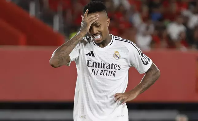 Real Madrid's Eder Militao reacts during a Spanish La Liga soccer match between Mallorca and Real Madrid at the Son Moix Stadium in Palma de Mallorca, Spain, Sunday, Aug. 18, 2024. (AP Photo/Francisco Ubilla)