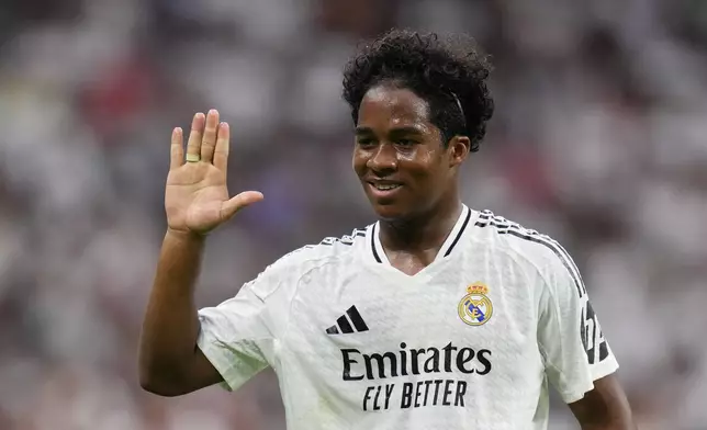 Real Madrid's Endrick celebrates after scoring his side's third goal during the Spanish La Liga soccer match between Real Madrid and Valladolid at the Santiago Bernabeu stadium in Madrid, Spain, Sunday, Aug. 25, 2024. (AP Photo/Manu Fernandez)