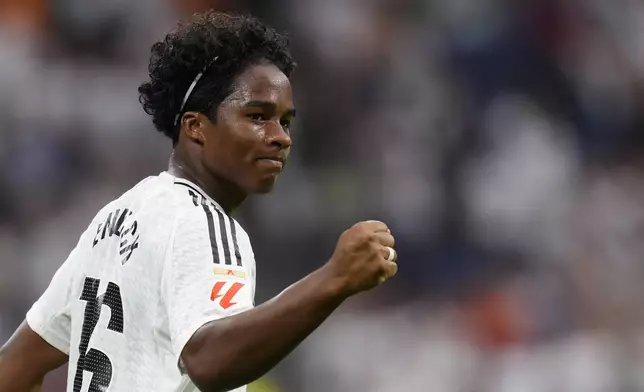 Real Madrid's Endrick celebrates after scoring his side's third goal during the Spanish La Liga soccer match between Real Madrid and Valladolid at the Santiago Bernabeu stadium in Madrid, Spain, Sunday, Aug. 25, 2024. (AP Photo/Manu Fernandez)