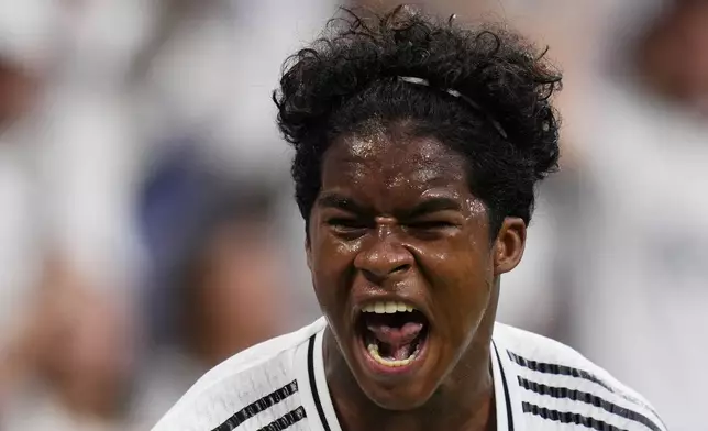 Real Madrid's Endrick celebrates after scoring his side's third goal during the Spanish La Liga soccer match between Real Madrid and Valladolid at the Santiago Bernabeu stadium in Madrid, Spain, Sunday, Aug. 25, 2024. (AP Photo/Manu Fernandez)