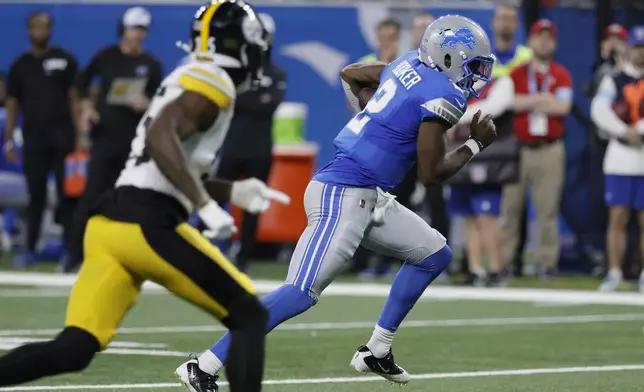 Detroit Lions quarterback Hendon Hooker (2) scrambles during the first half of an NFL preseason football game against the Pittsburgh Steelers, Saturday, Aug. 24, 2024, in Detroit. (AP Photo/Duane Burleson)