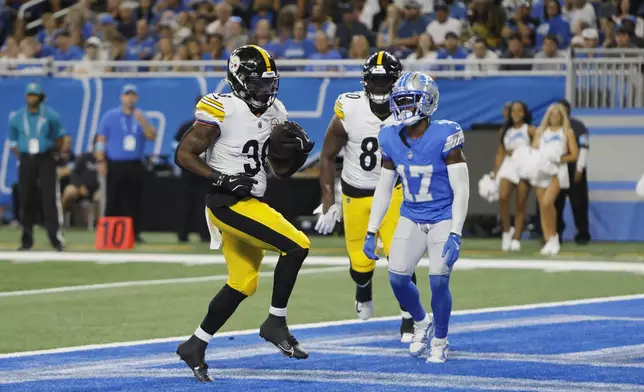 Pittsburgh Steelers running back La'Mical Perine runs into the endzone for a 1-yard rushing touchdown during the first half of an NFL preseason football game against the Detroit Lions, Saturday, Aug. 24, 2024, in Detroit. (AP Photo/Duane Burleson)