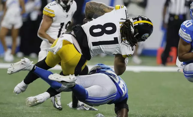 Pittsburgh Steelers tight end MyCole Pruitt (81) is tackled by Detroit Lions safety C.J. Moore (38) during the first half of an NFL preseason football game, Saturday, Aug. 24, 2024, in Detroit. (AP Photo/Duane Burleson)