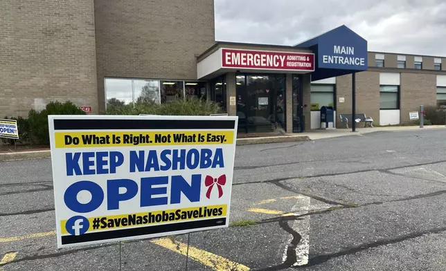 A sign pushing to keep the hospital open stands outside Nashoba Valley Medical Center in Ayer, Mass., Tuesday, Aug. 20, 2024. (AP Photo/Nick Perry)