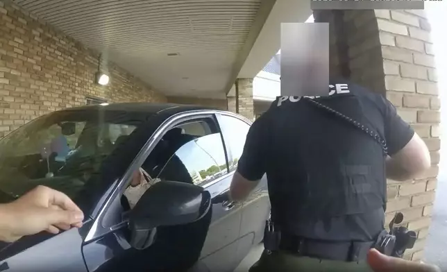 FILE - This still image from bodycam video released by the Blendon Township Police on Friday, Sept. 1, 2023, shows a bullet hole in the windshield of a car with Ta'Kiya Young inside after she was shot by a police officer outside a grocery store in Blendon Township, Ohio, a suburb of Columbus, on Aug. 24. The video was pixelated by the source. (Blendon Township Police via AP, File)